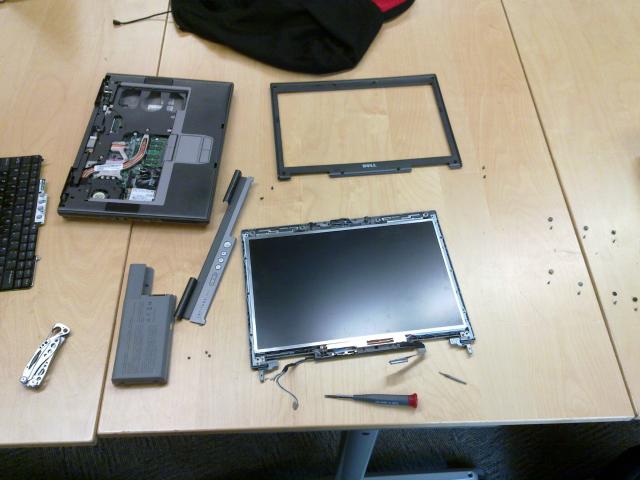 Laptop in pieces on the table.