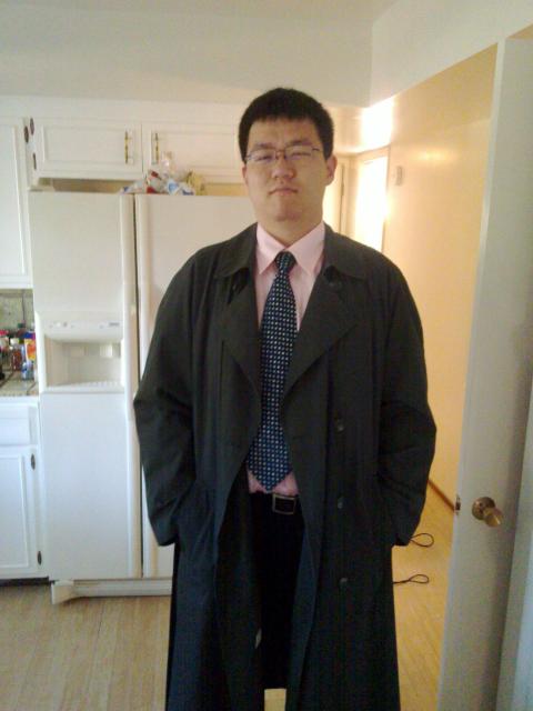 Chuan looking like an Asian businessman